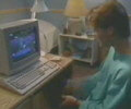 Boy sitting in front of Amiga 500
