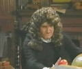 Isaac Newton holding an apple in his hand
