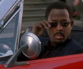 black man in red car