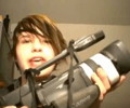 Ethan holding a classic 90s Camera